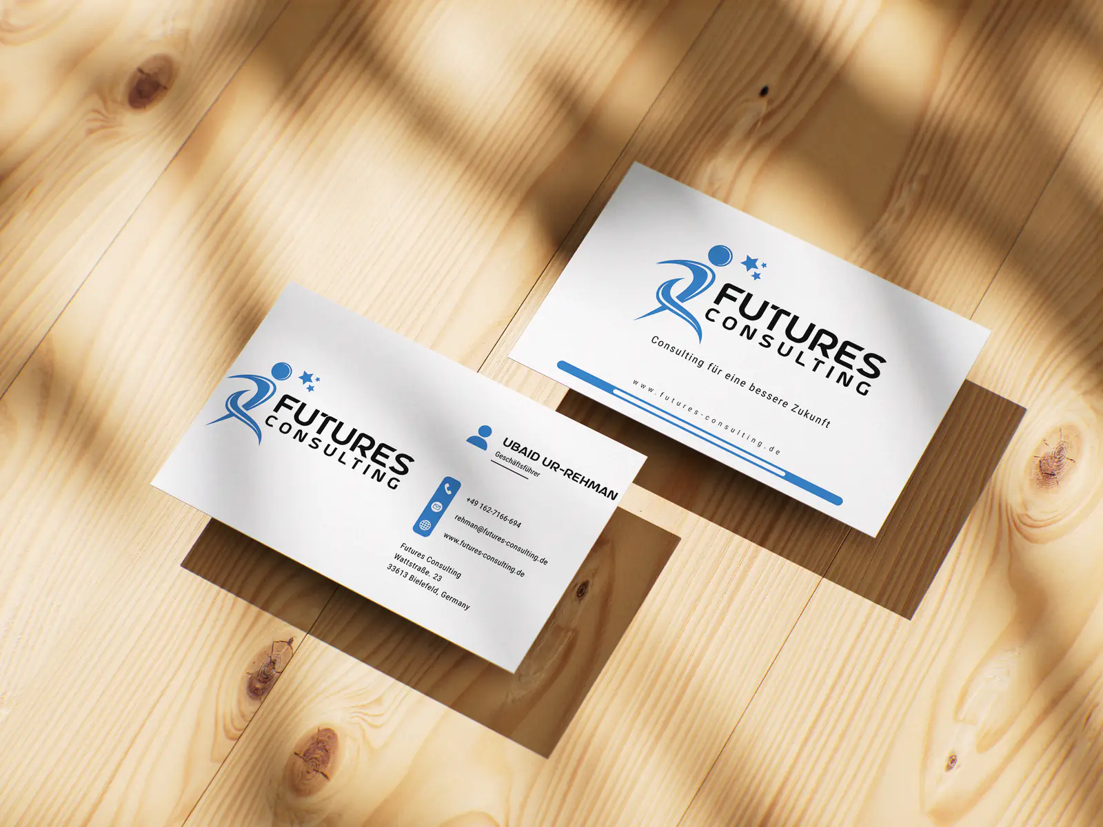 Futures Consulting business cards on a wooden surface