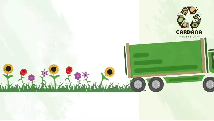 Waste truck driving past a line of flowers