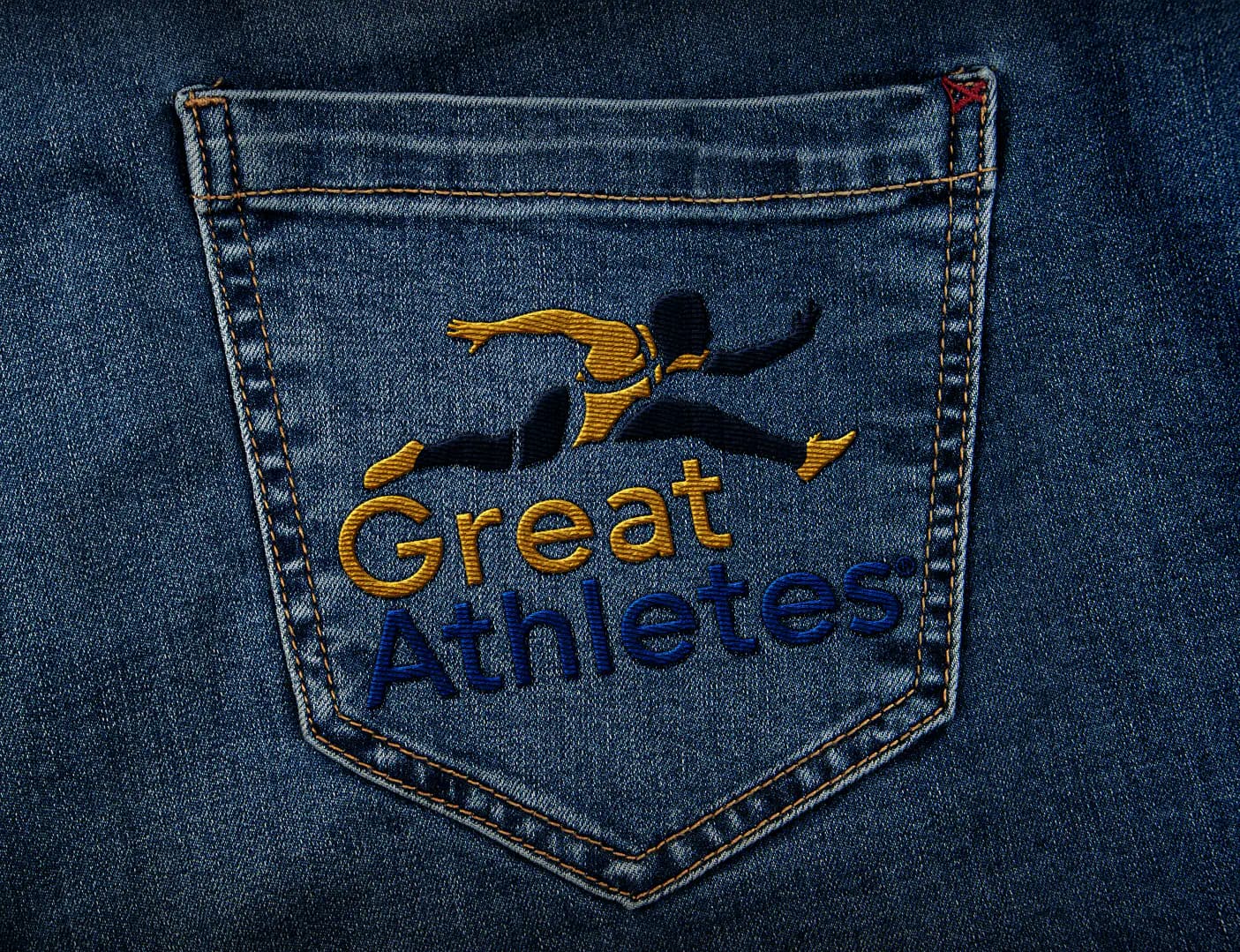 Great Athletes logo embroidered on a denim pocket